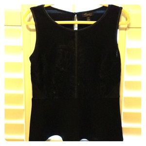 Black elegant sleeveless top.